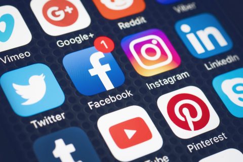 social media app logos on phone screen