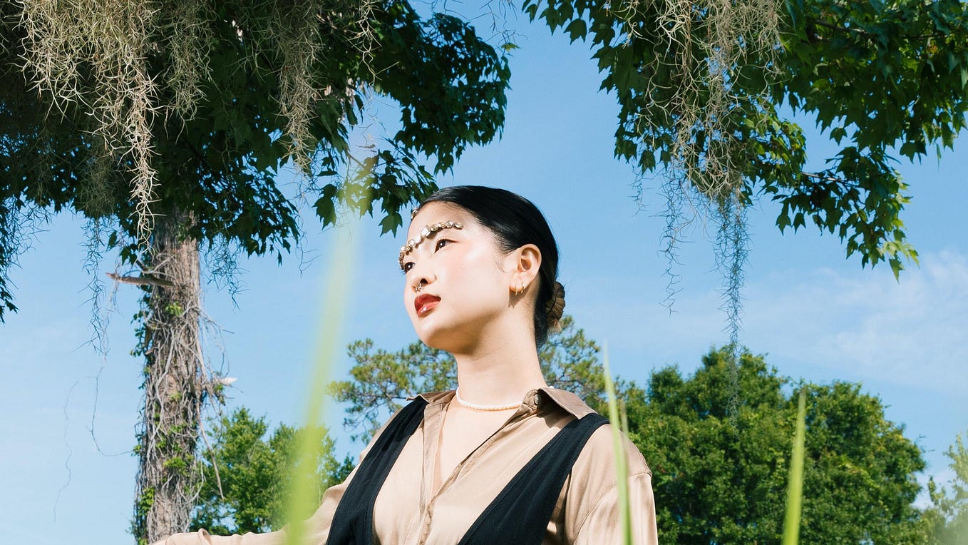 Asian lady looking interested in my story